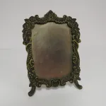 Lote: 7 - Lote: 7 - Crucifijo y portaretrato en bronce