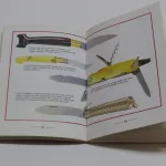 Lote: 125 - Lote: 125 - Libro y navaja
